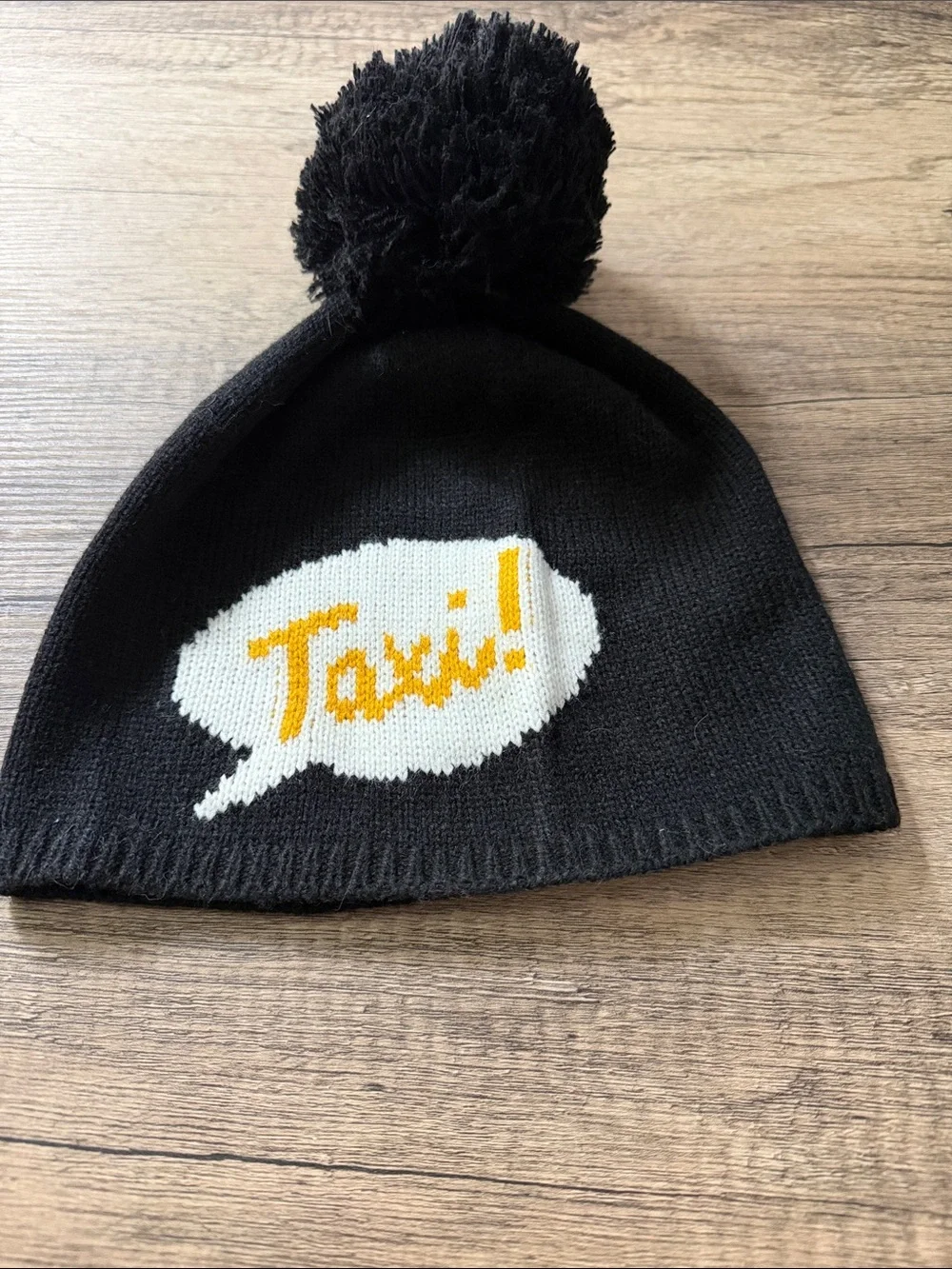 Kids Black Pom Beanie with 'Taxi!' Graphic